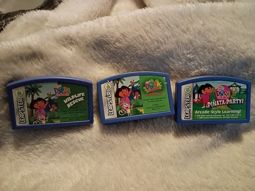 Leapster games DORA the EXPLORER PINATA PARTY & WILDLIFE RESCUE & Animal Rescue